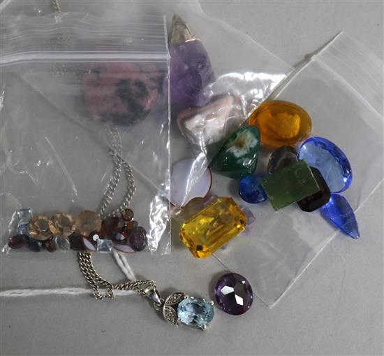 A blue topaz pendant on Sterling silver chain and a small collection of unmounted coloured stones (two carved)